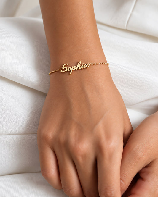Written in Silver bracelet in a gold-plated finish, worn on the wrist