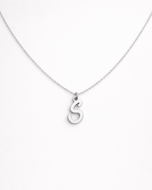 Silver necklace with a 'S' pendant on a white background