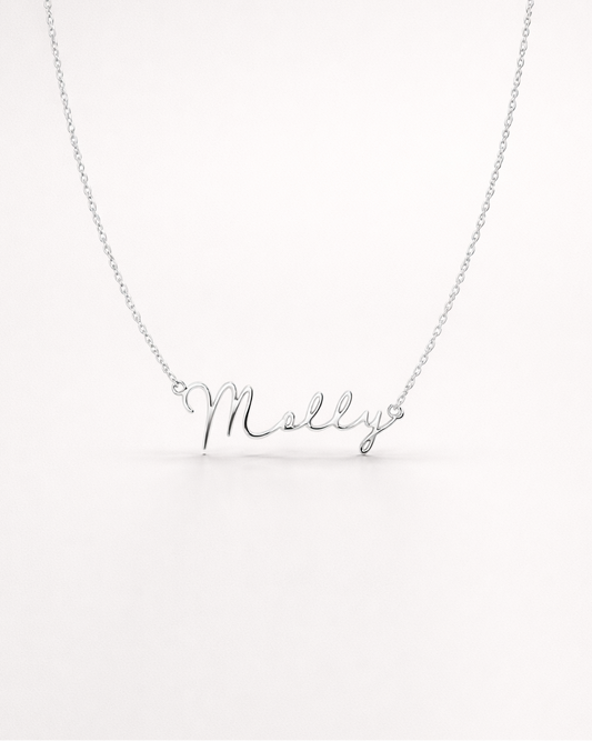 Silver necklace with 'Molly' pendant on a white background