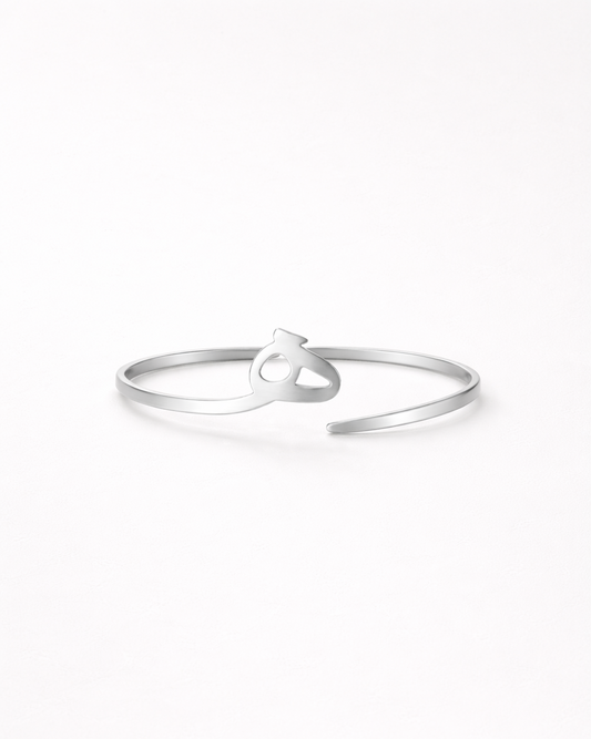 Silver ring with a knot design on a white background