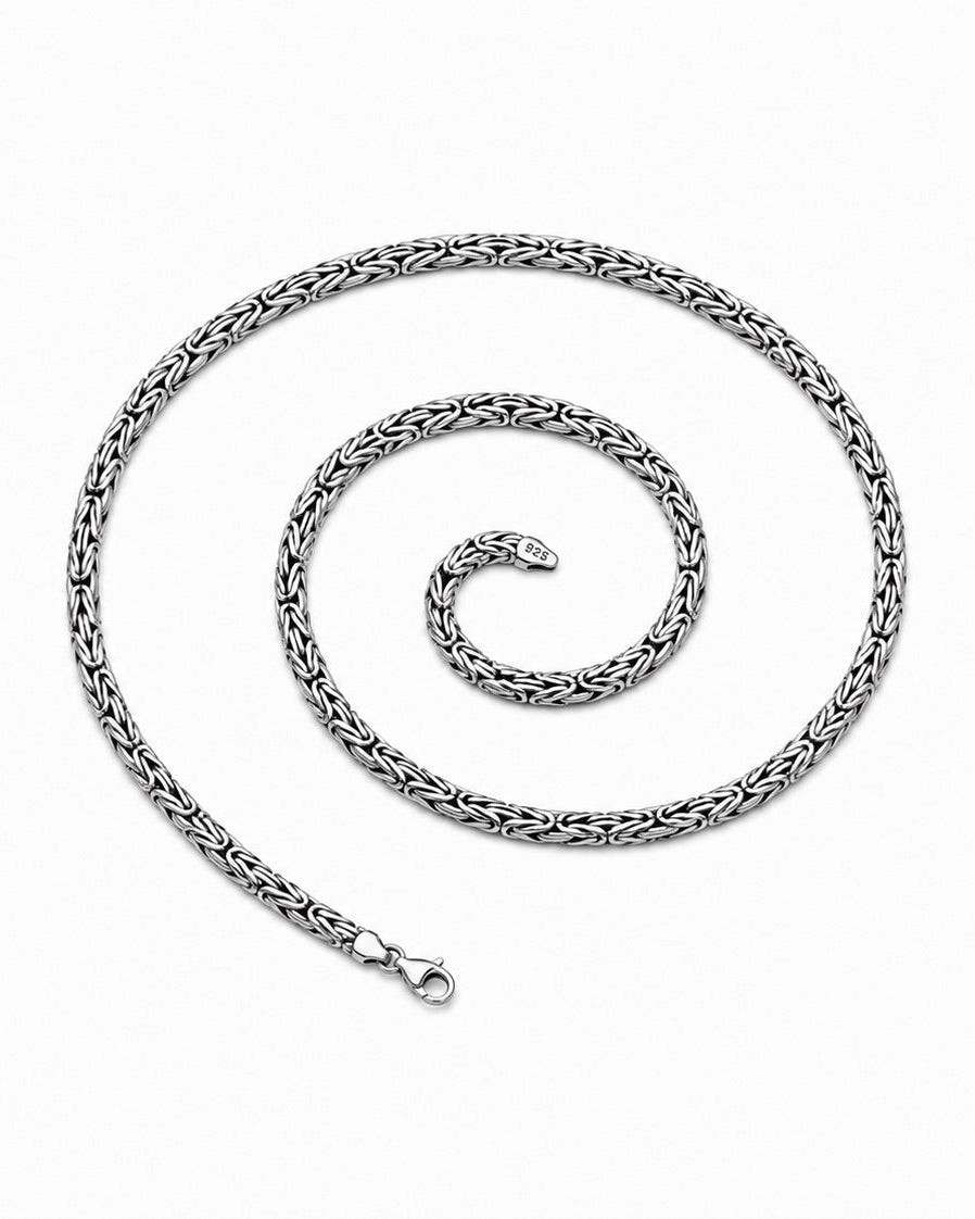 Silver chain necklace on a white background