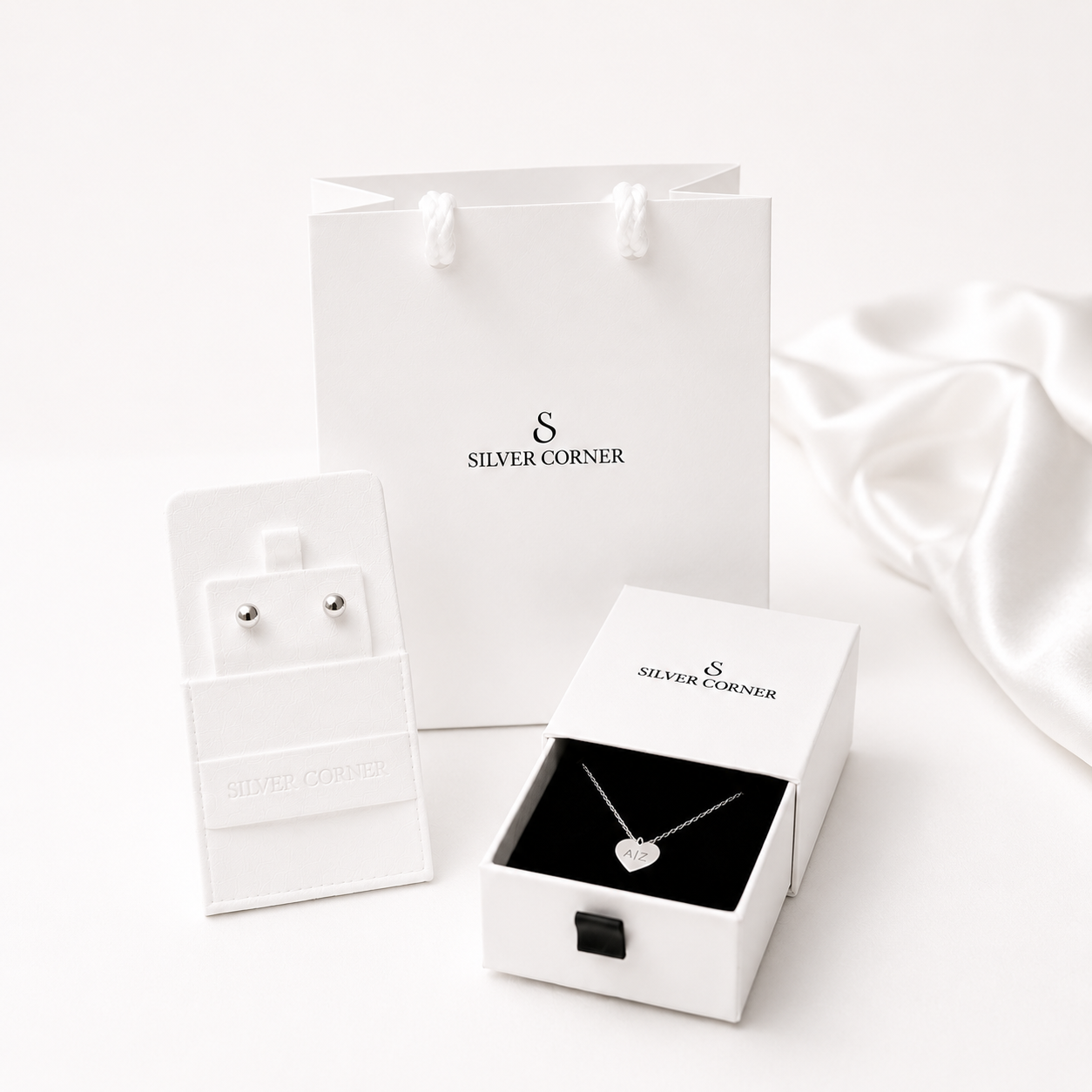 Jewelry set with 'Silver Corner' packaging on a white background