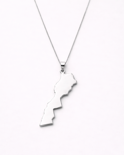 Silver necklace with a unique pendant on a white background