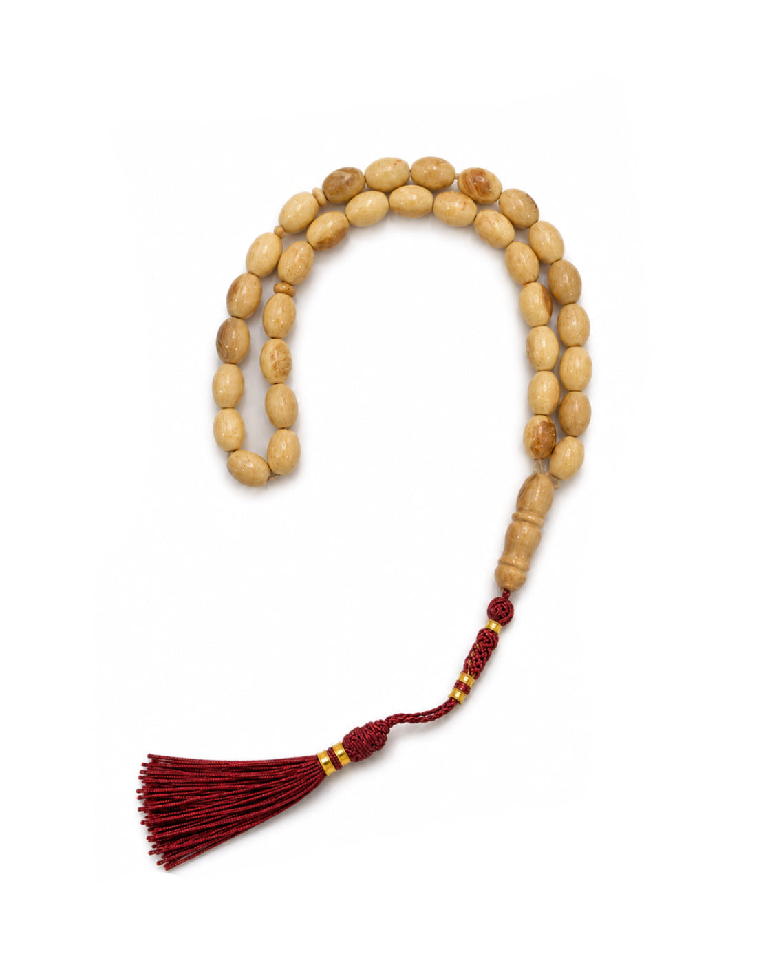 Wooden prayer beads with a red tassel on a white background