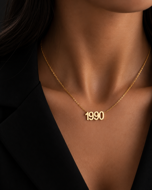 Gold-plated Year Necklace with 1990 pendant worn at the collarbone